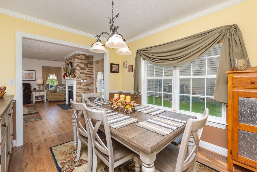 213 Inglecress Road Waynesboro, VA 22980 - Photo 23 of 68 a view of a dining room with furniture window and wooden floor