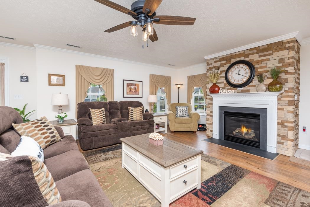 213 Inglecress Road Waynesboro, VA 22980 - Photo 8 of 68 a living room with furniture a clock and a fireplace