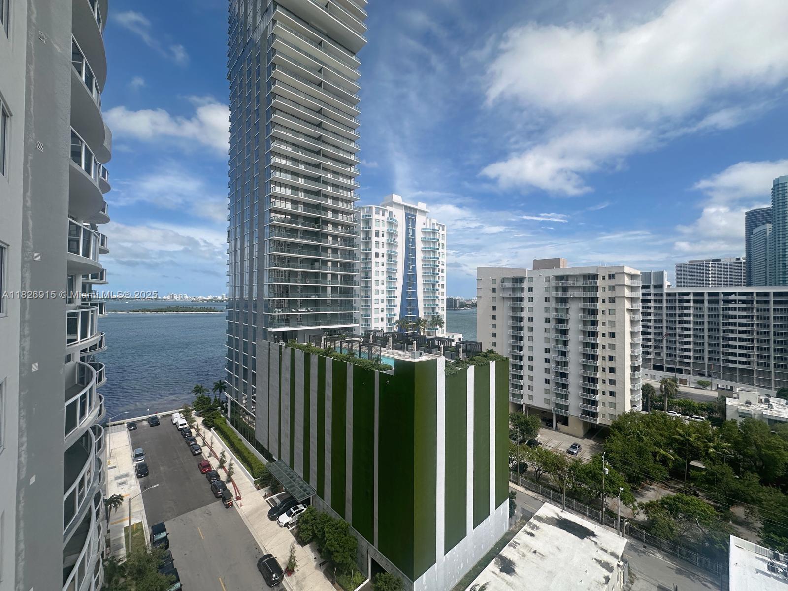 a view of a city with tall buildings