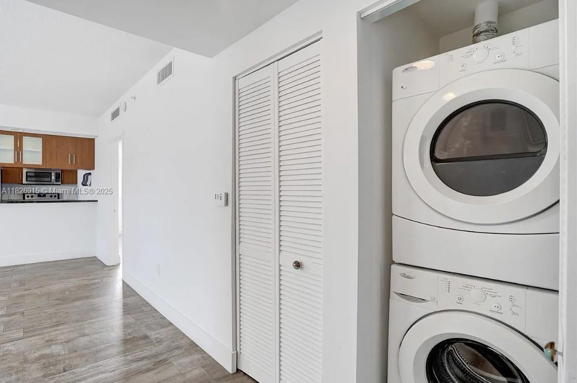 601 Northeast 23rd Street, Unit 1405 Miami, FL 33137 - Photo 16 of 23 a view of a hallway with washer and dryer