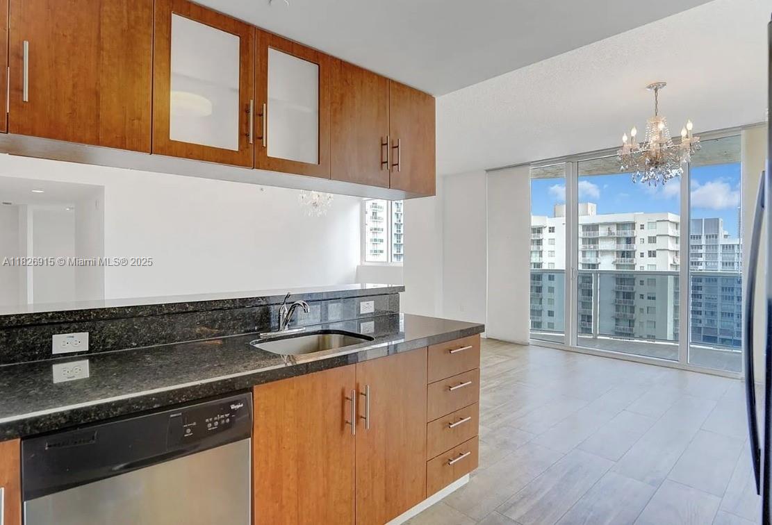 601 Northeast 23rd Street, Unit 1405 Miami, FL 33137 - Photo 9 of 23 a kitchen with stainless steel appliances granite countertop a sink and a granite counter tops
