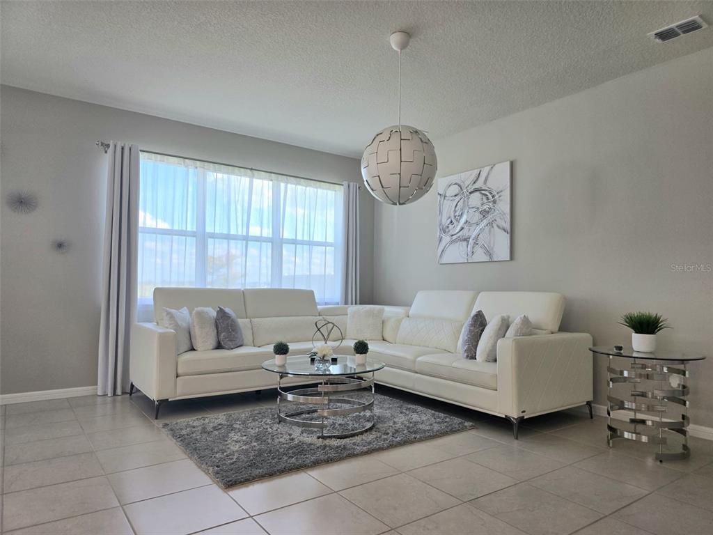 1973 Spring Shower Circle Kissimmee, FL 34744 - Photo 18 of 43 a living room with furniture