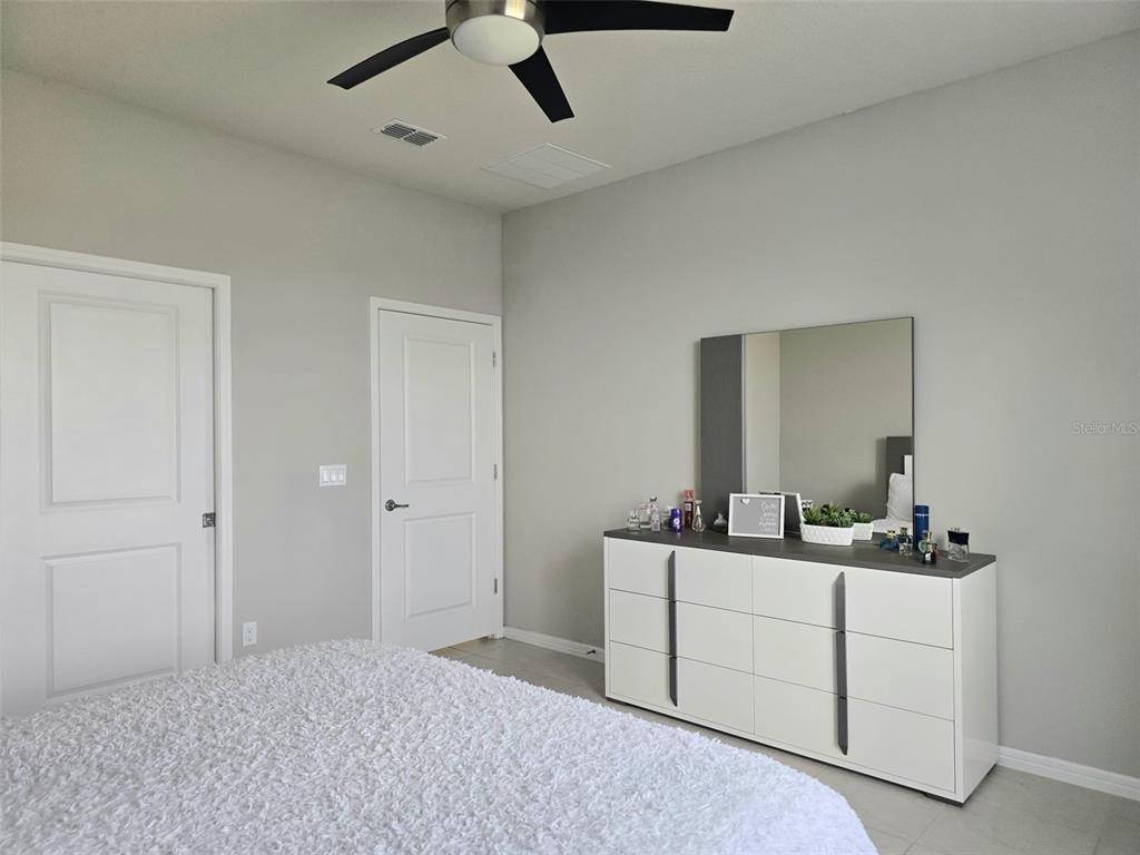 1973 Spring Shower Circle Kissimmee, FL 34744 - Photo 21 of 43 a bathroom with a sink and a mirror