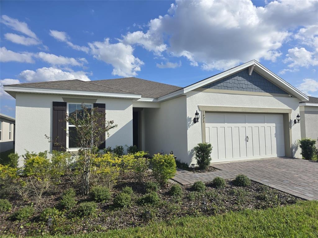 1973 Spring Shower Circle Kissimmee, FL 34744 - Photo 3 of 43 a front view of a house with garden