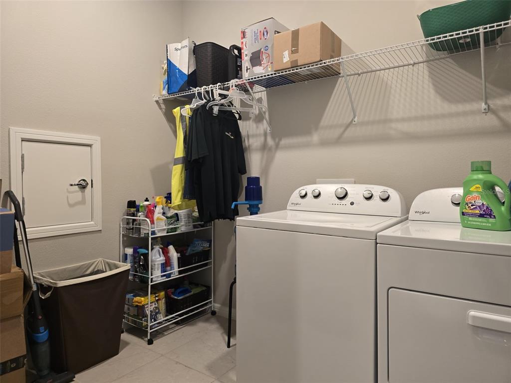 1973 Spring Shower Circle Kissimmee, FL 34744 - Photo 32 of 43 a utility room with dryer and washer