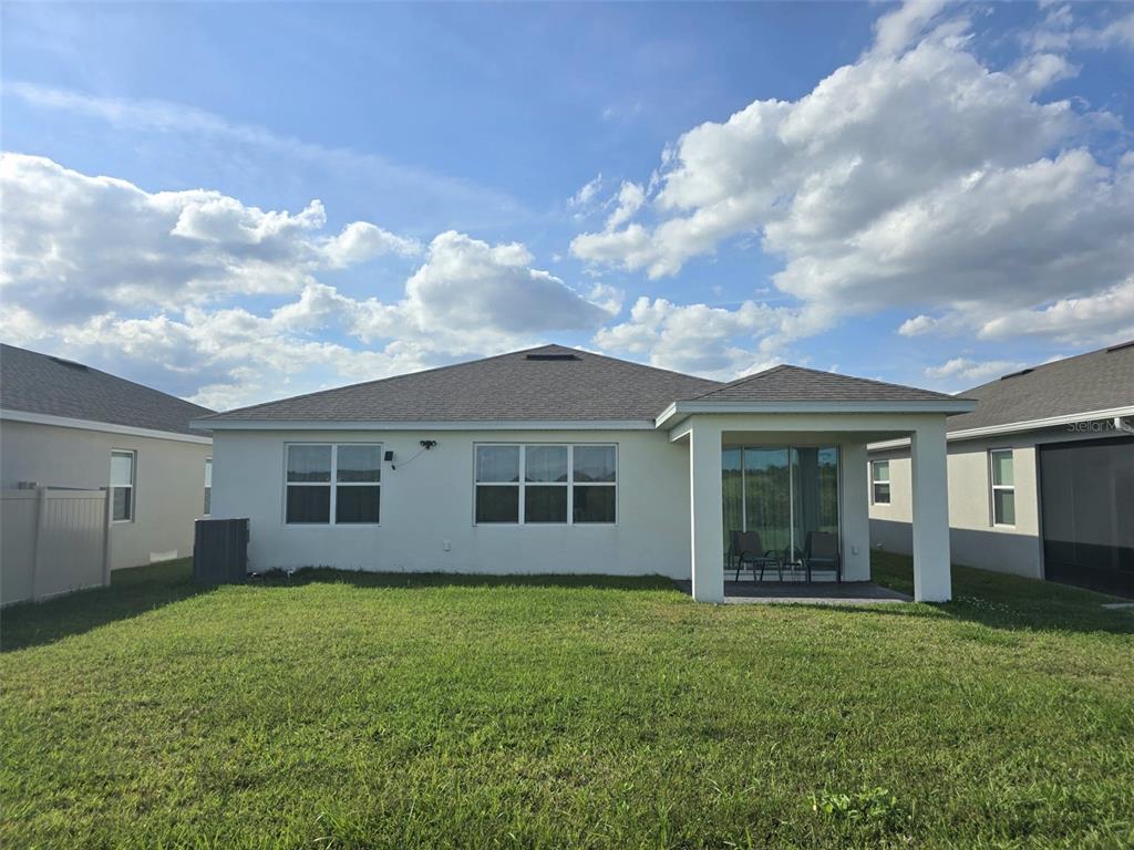 1973 Spring Shower Circle Kissimmee, FL 34744 - Photo 34 of 43 a view of a house with yard and garden