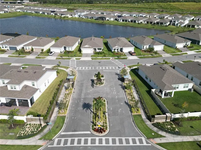 an aerial view of a house with a lake view