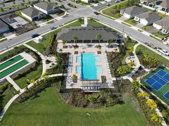 an aerial view of a house with a yard