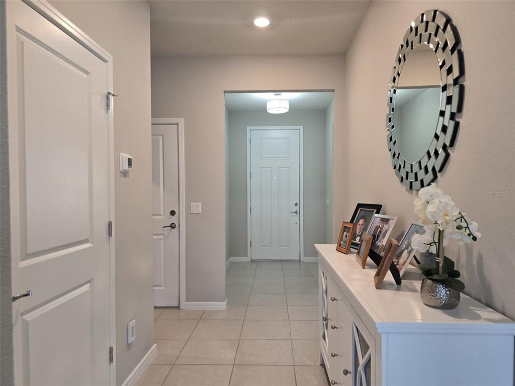 1973 Spring Shower Circle Kissimmee, FL 34744 - Photo 7 of 43 a view of a bathroom with a sink and mirror