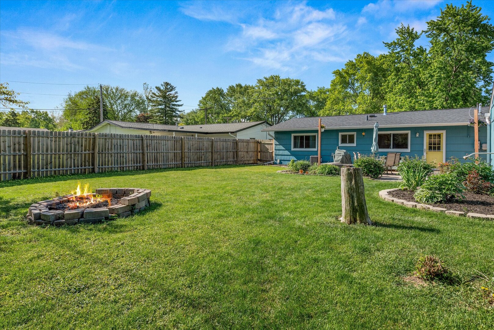 14 Hampton Road Montgomery, IL 60538 - Photo 22 of 27 a view of a backyard with a garden and plants