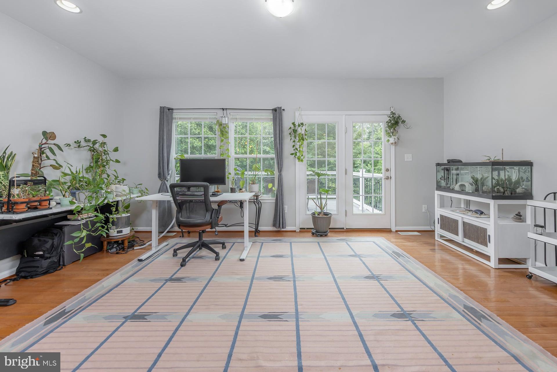 372 Concetta Drive Mount Royal, NJ 08061 - Photo 11 of 25 a living room with patio furniture and a floor to ceiling window