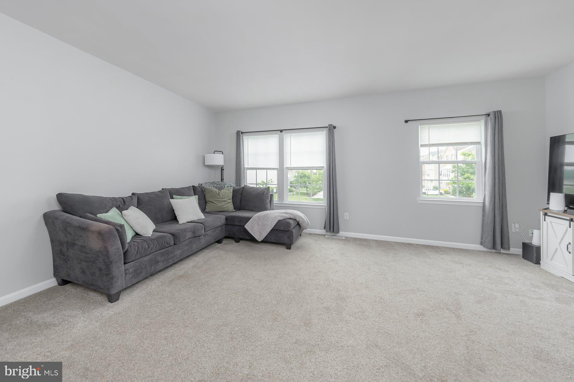 372 Concetta Drive Mount Royal, NJ 08061 - Photo 12 of 25 a living room with furniture a window and a couch