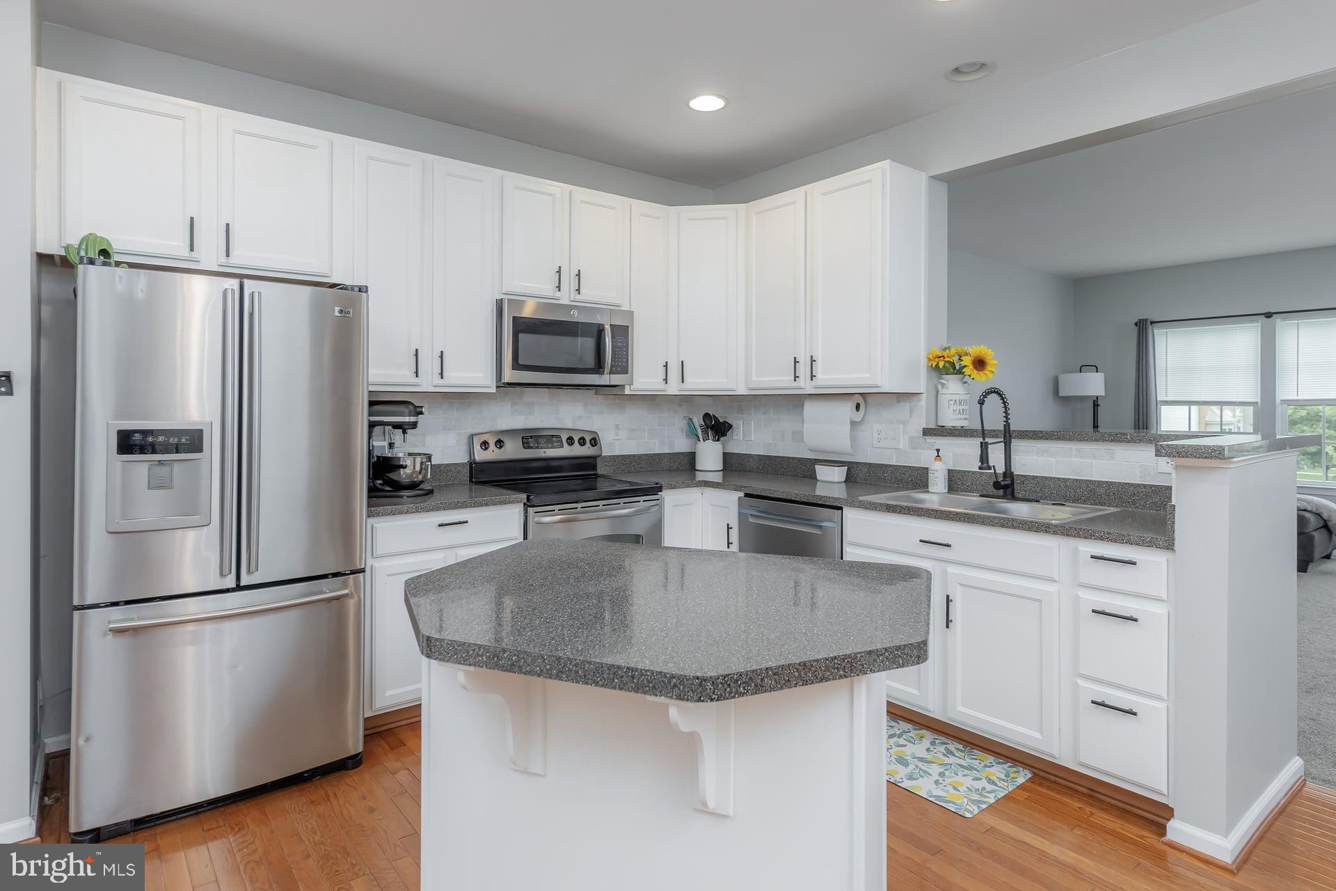 372 Concetta Drive Mount Royal, NJ 08061 - Photo 8 of 25 a kitchen with kitchen island a sink stove and refrigerator