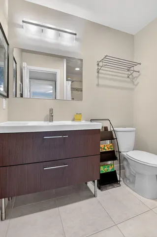 a bedroom with bed and a chandelier