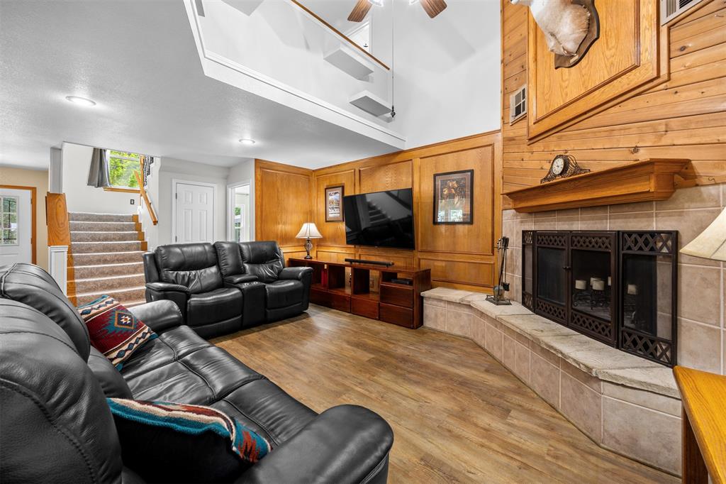 881 Wild Road Van Alstyne, TX 75495 - Photo 8 of 40 a living room with furniture and a fireplace