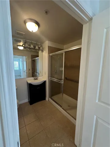 a bathroom with a toilet a sink and a shower
