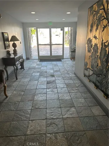 a view of entryway with a window and a rug