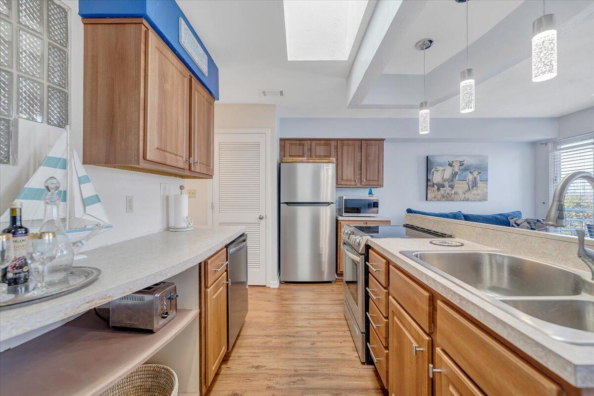 71 Waterside Circle, Unit D6 Moneta, VA 24121 - Photo 13 of 52 a kitchen with stainless steel appliances granite countertop a sink stove and refrigerator