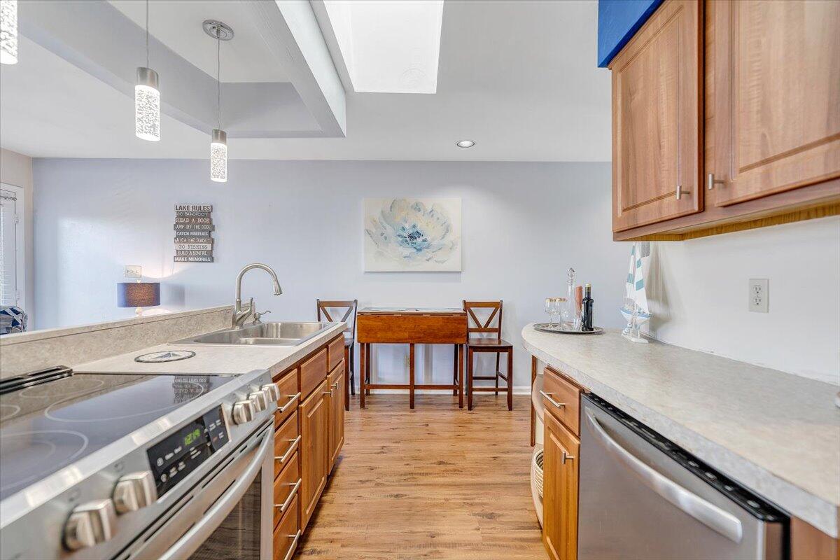 71 Waterside Circle, Unit D6 Moneta, VA 24121 - Photo 14 of 52 a kitchen with stainless steel appliances granite countertop a sink and a stove