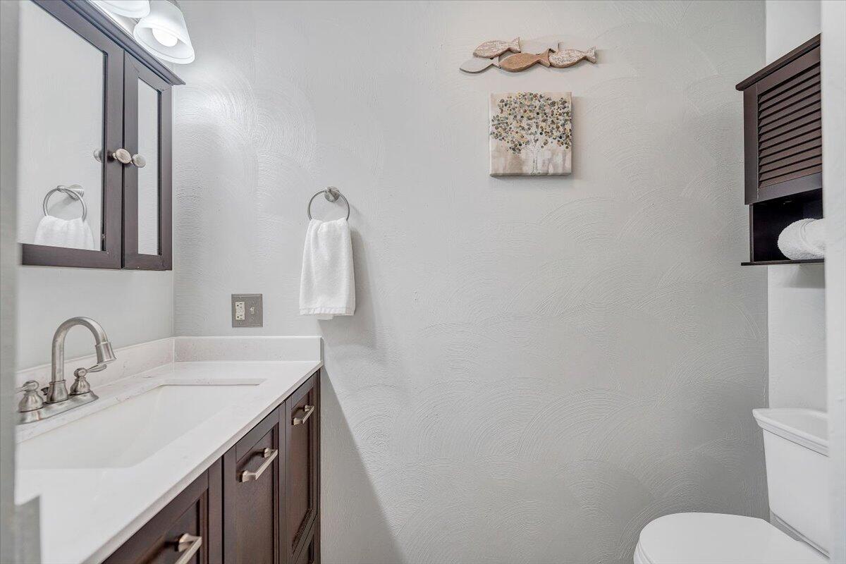 71 Waterside Circle, Unit D6 Moneta, VA 24121 - Photo 22 of 52 a bathroom with a toilet sink and mirror