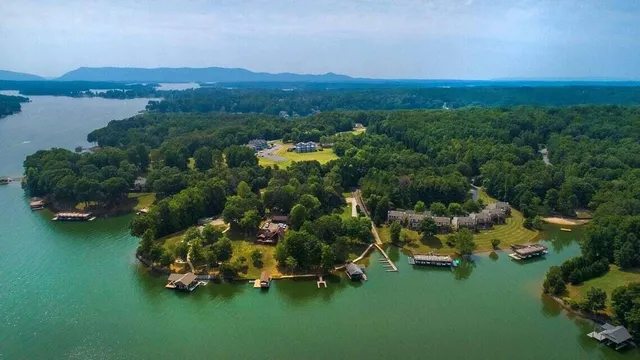 a swimming pool with outdoor seating and yard