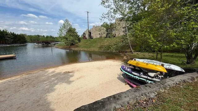 a view of a house with a yard and sitting area