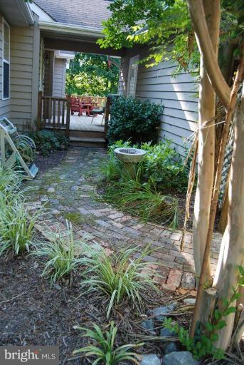7218 Clyde Jones Road Owings, MD 20736 - Photo 2 of 9 a backyard of a house with seating space