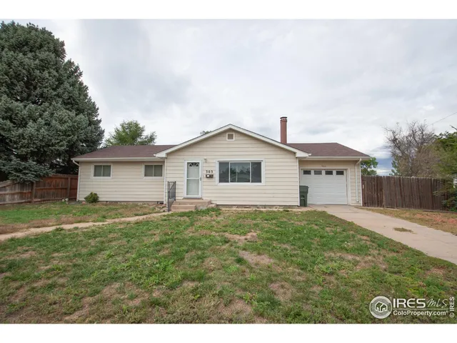 a view of front of house with a yard