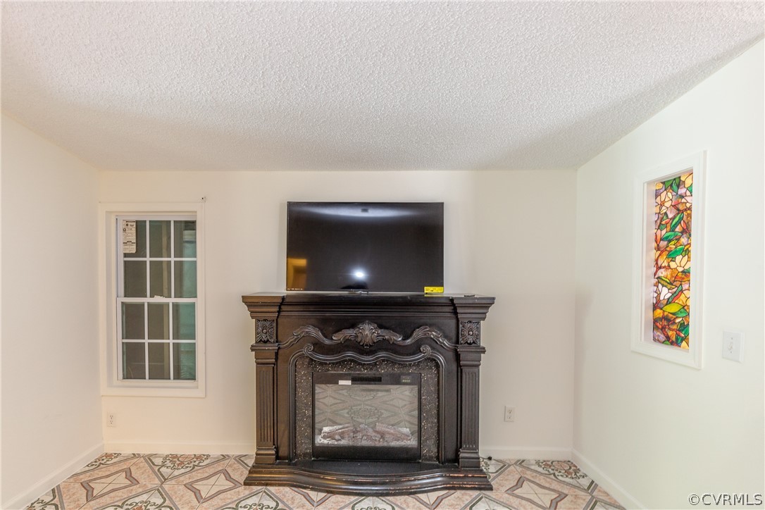 2924 Whitehouse Road Colonial Heights, VA 23834 - Photo 24 of 50 a living room with a fireplace and a table