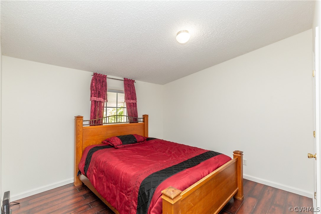 2924 Whitehouse Road Colonial Heights, VA 23834 - Photo 27 of 50 a bedroom with a bed and wooden floor