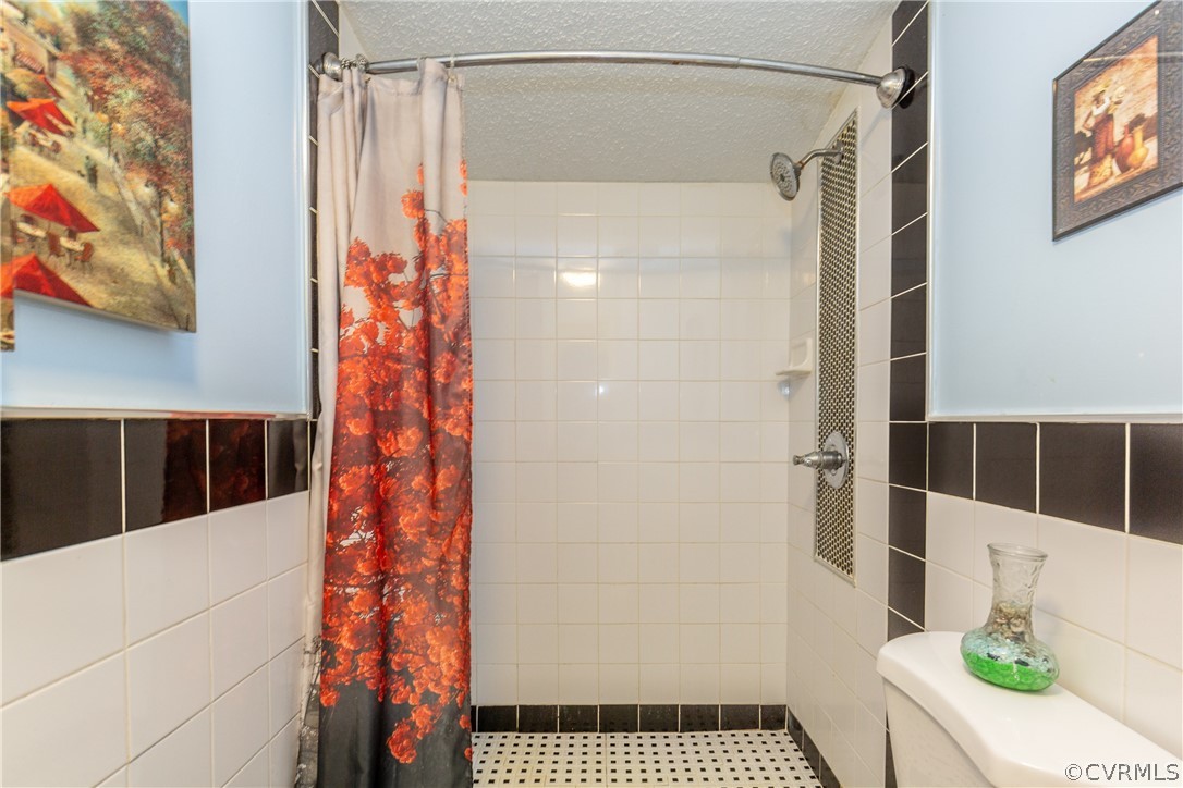 2924 Whitehouse Road Colonial Heights, VA 23834 - Photo 29 of 50 a bathroom with a shower and a toilet