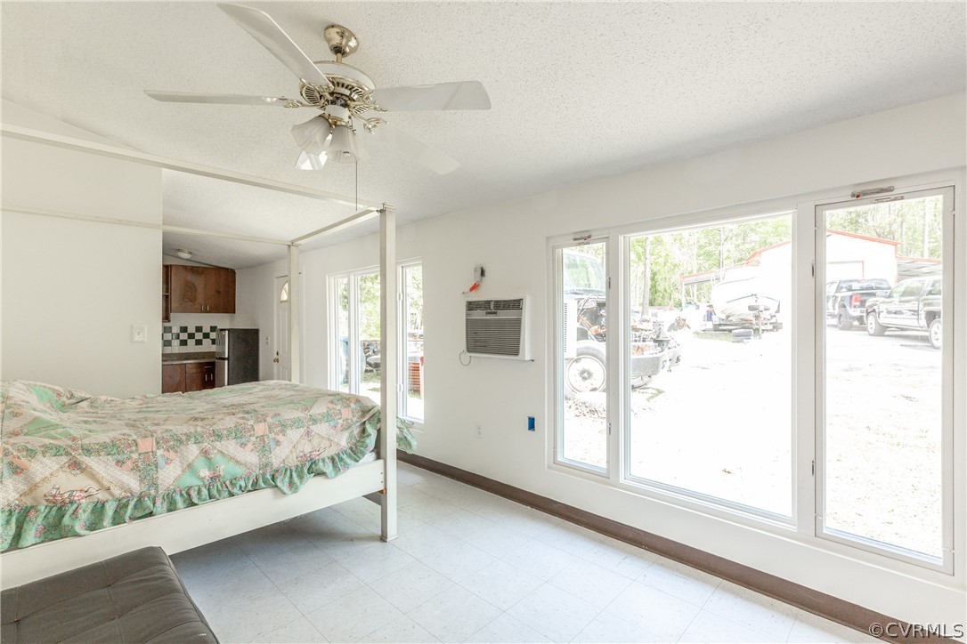 2924 Whitehouse Road Colonial Heights, VA 23834 - Photo 39 of 50 a bedroom with a large bed and a chandelier fan