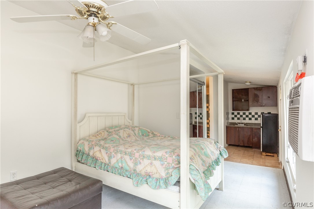 2924 Whitehouse Road Colonial Heights, VA 23834 - Photo 41 of 50 a bedroom with a bed and a chandelier