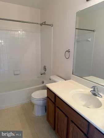 a bathroom with a shower and a toilet