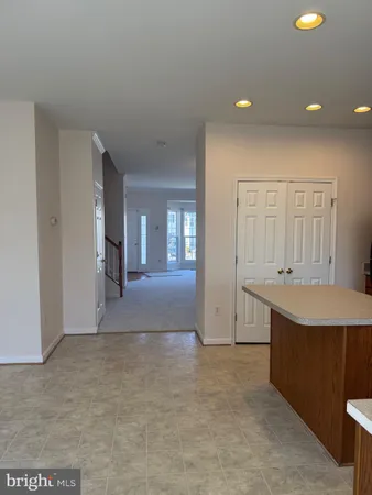 a view of a kitchen with a sink and cabinet area