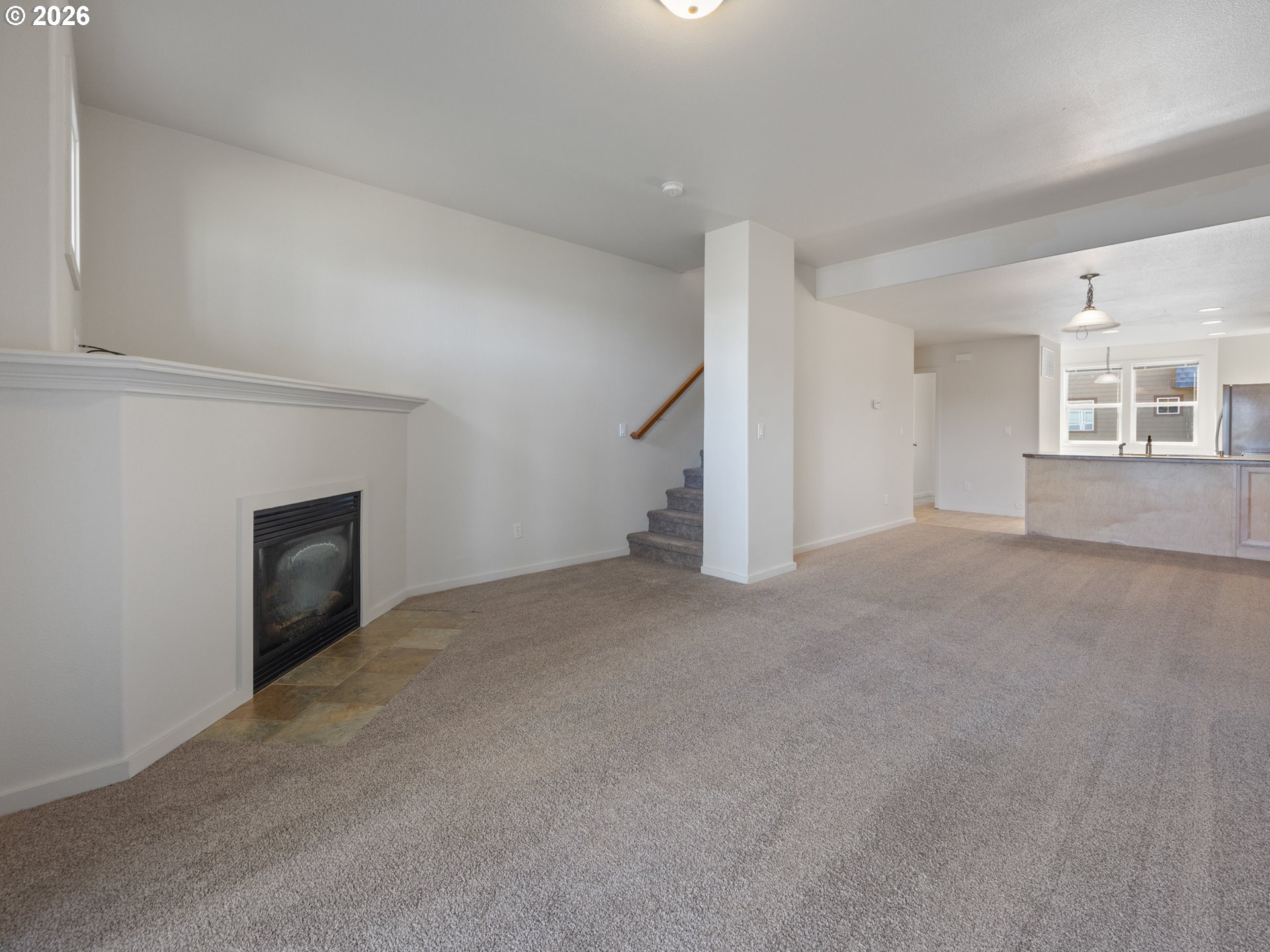 475 Southeast 35th Street, Unit C15 Newport, OR 97366 - Photo 18 of 41 a view of empty room with wooden floor and fireplace