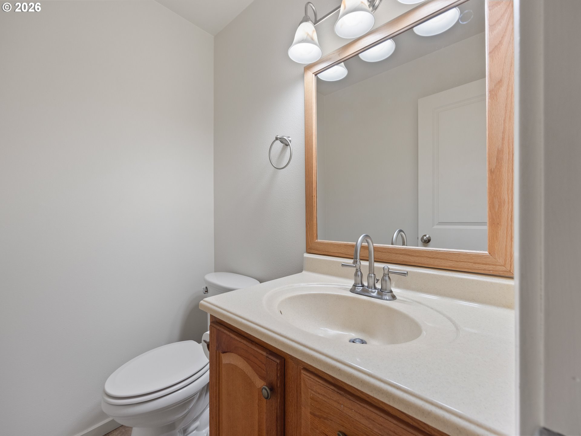 475 Southeast 35th Street, Unit C15 Newport, OR 97366 - Photo 19 of 41 a bathroom with a toilet a sink and mirror