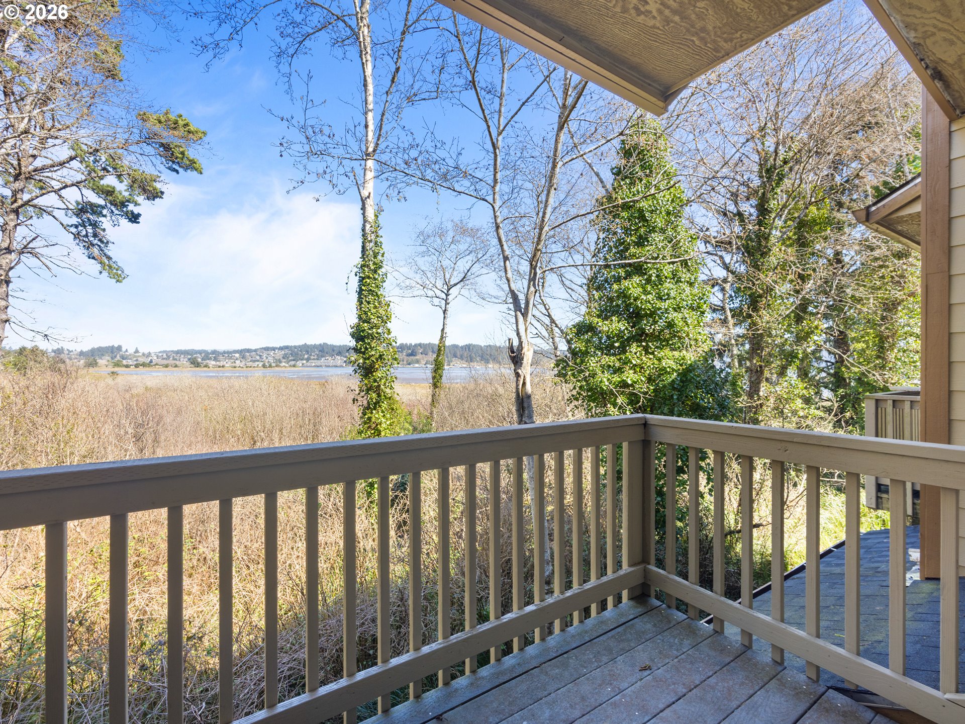 475 Southeast 35th Street, Unit C15 Newport, OR 97366 - Photo 21 of 41 a view of a balcony with wooden floor and fence