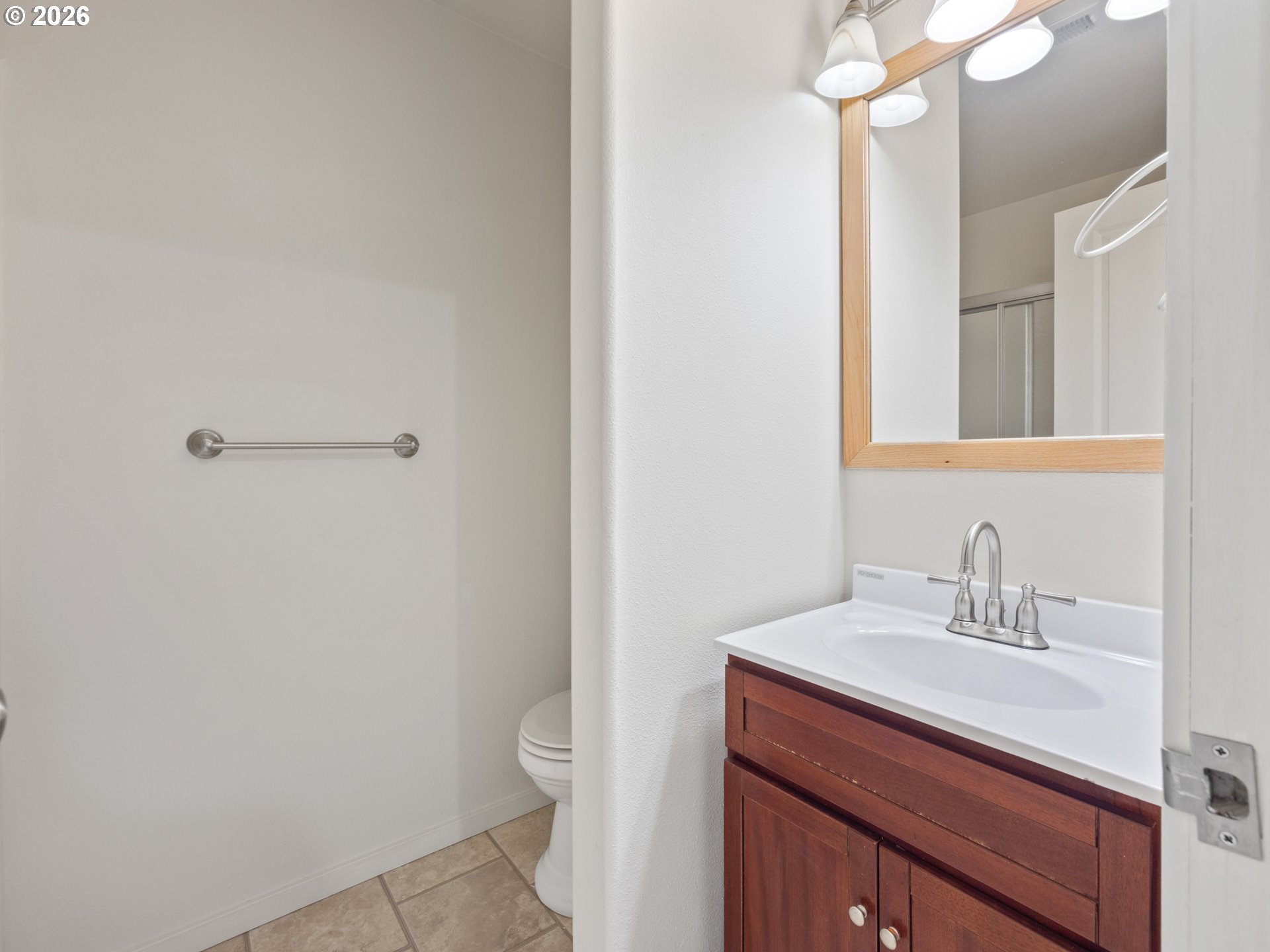 475 Southeast 35th Street, Unit C15 Newport, OR 97366 - Photo 27 of 41 a bathroom with a sink a toilet and a mirror