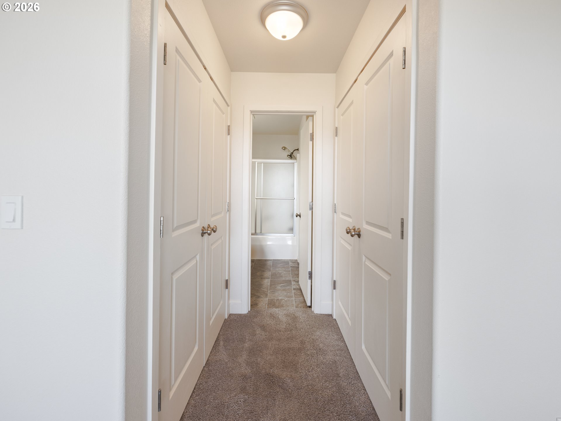 475 Southeast 35th Street, Unit C15 Newport, OR 97366 - Photo 34 of 41 a view of a hallway with wooden shelves