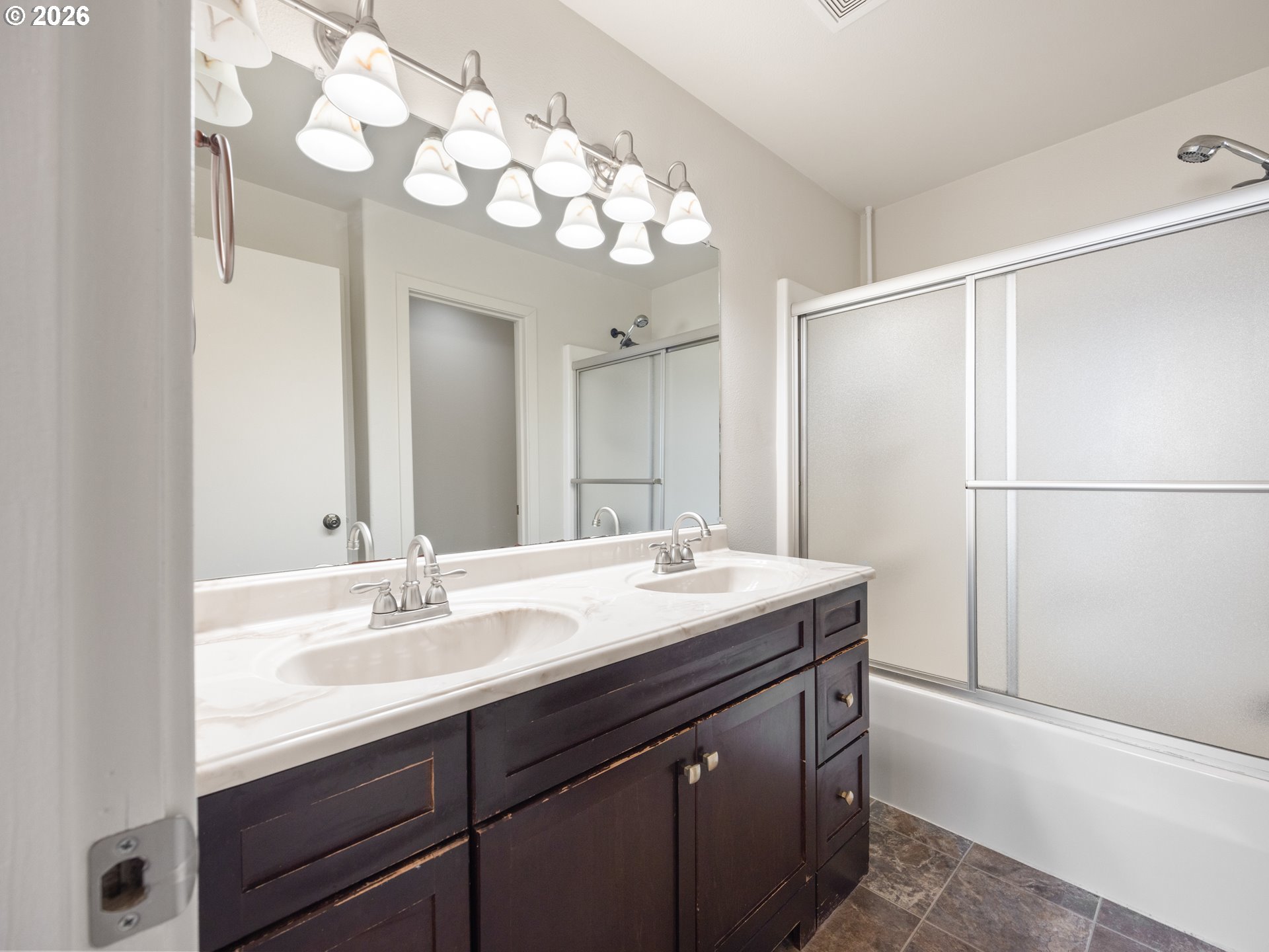 475 Southeast 35th Street, Unit C15 Newport, OR 97366 - Photo 35 of 41 a bathroom with a sink vanity granite and a mirror