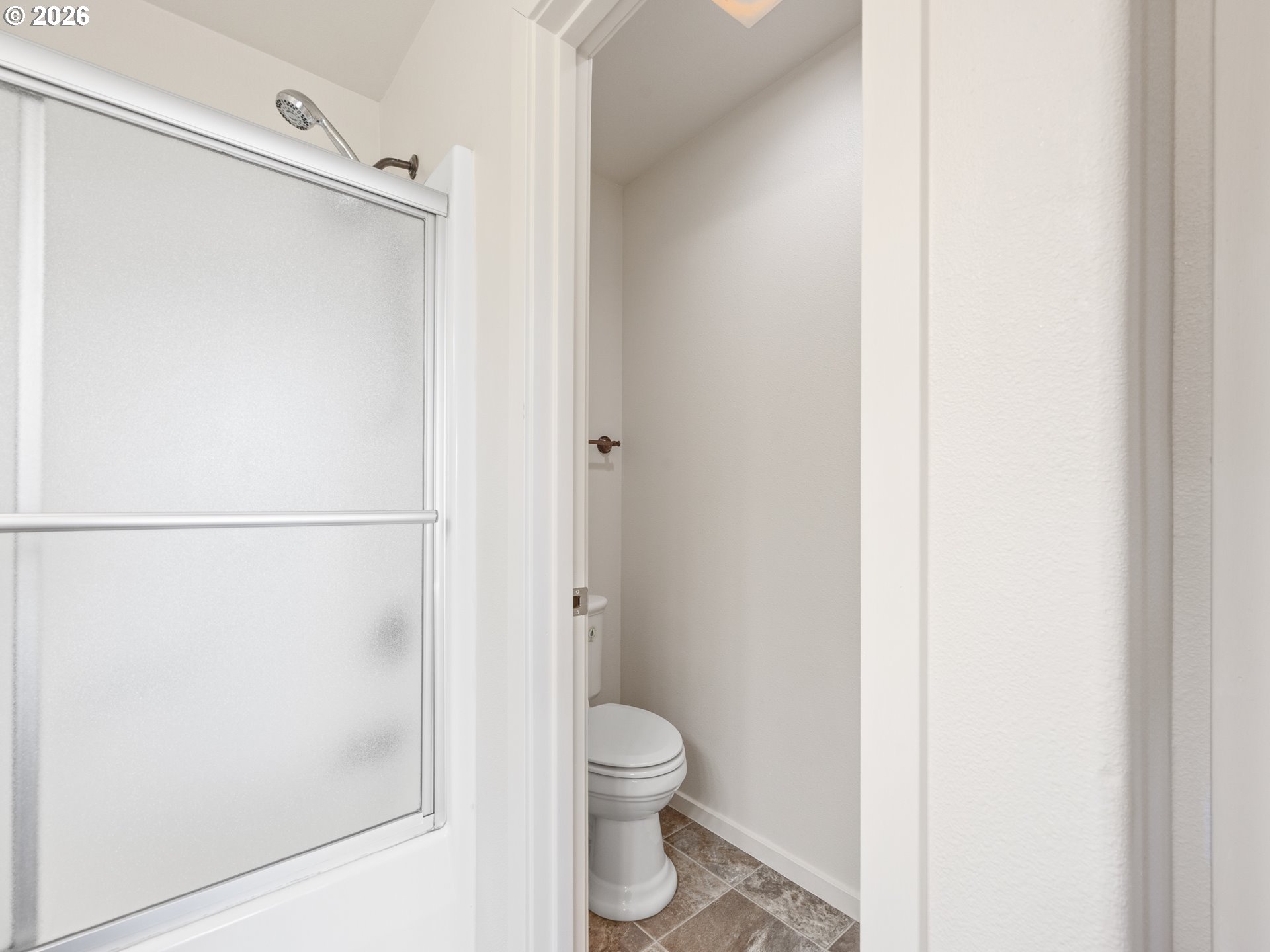 475 Southeast 35th Street, Unit C15 Newport, OR 97366 - Photo 36 of 41 a bathroom with a granite countertop shower and a toilet