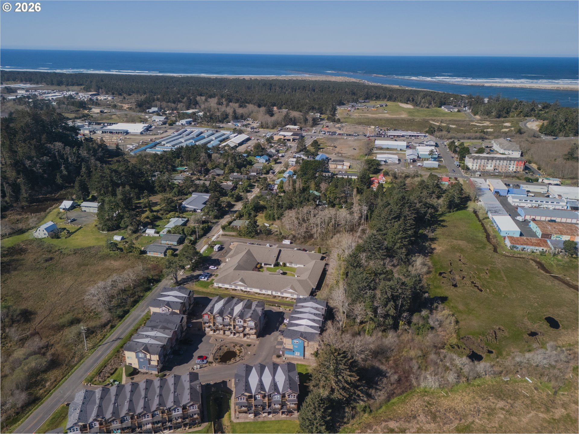 475 Southeast 35th Street, Unit C15 Newport, OR 97366 - Photo 40 of 41 an aerial view of residential building with ocean view
