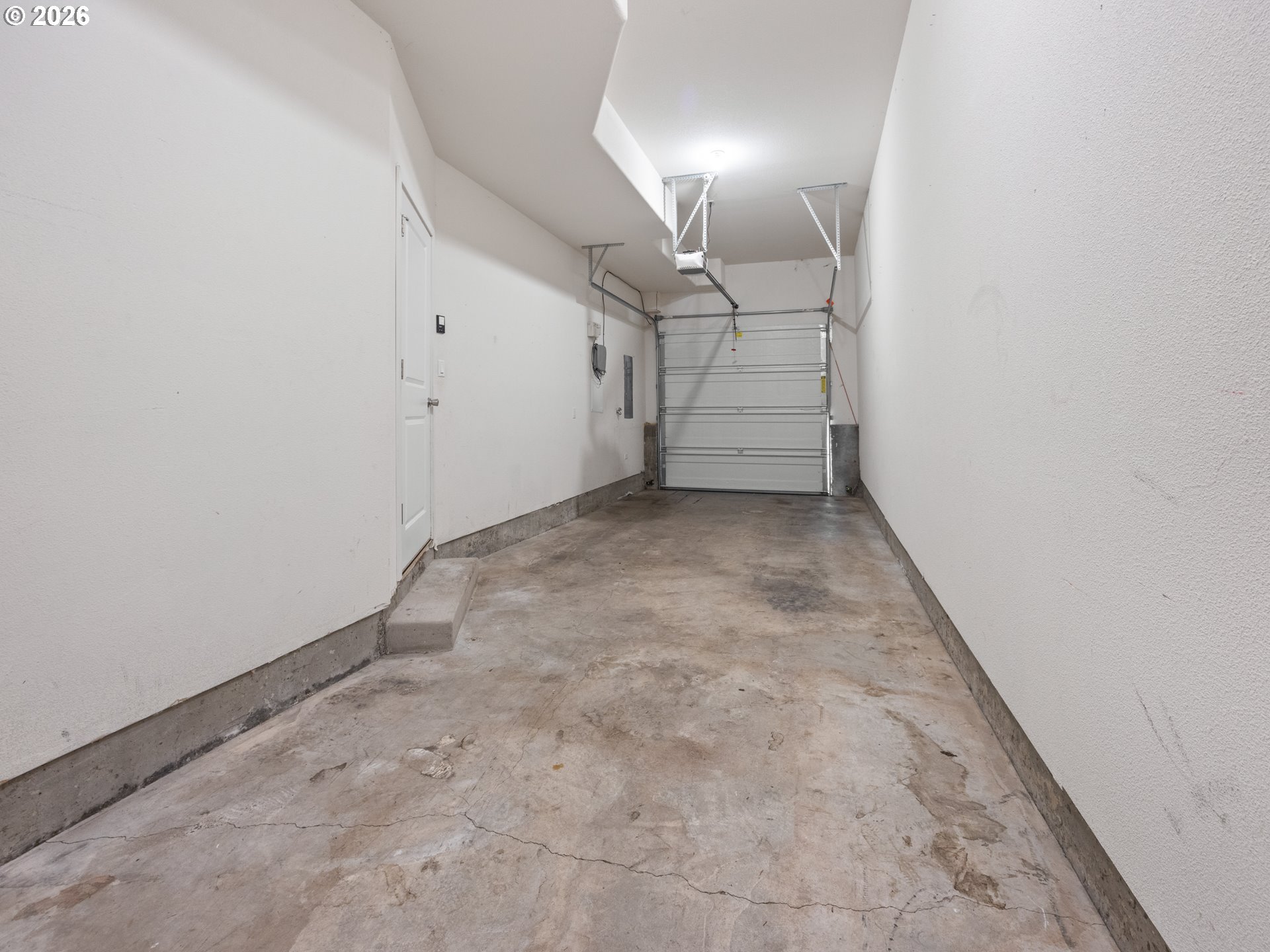 475 Southeast 35th Street, Unit C15 Newport, OR 97366 - Photo 5 of 41 an empty room with staircase and mirror