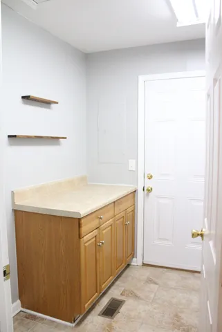 a utility room with cabinets