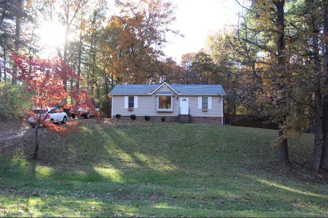 a house view with swimming pool