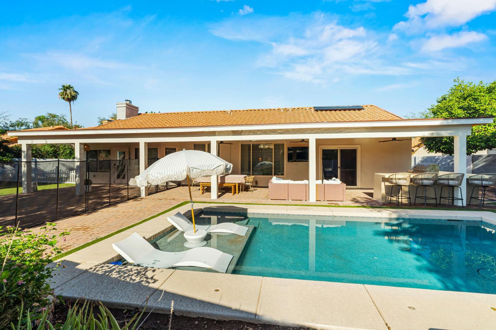 5449 East Phelps Road Scottsdale, AZ 85254 - Photo 23 of 28 a view of a house with a yard patio and swimming pool