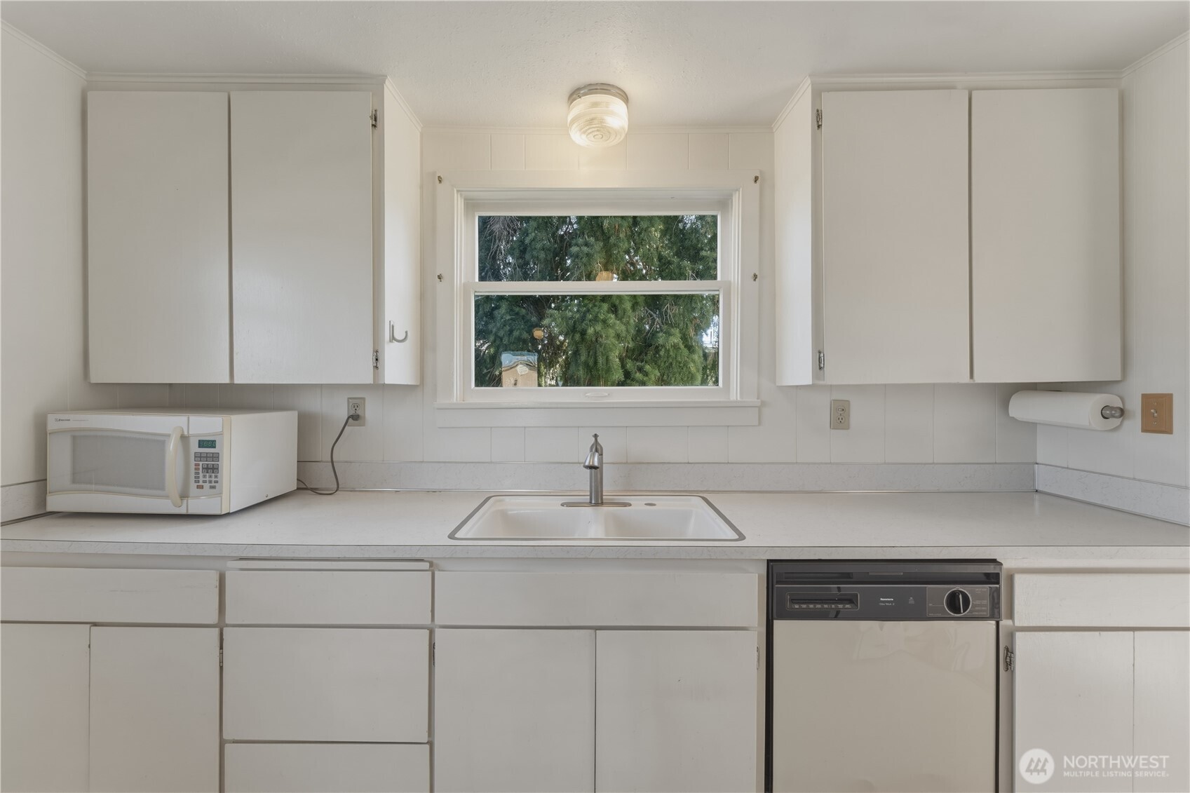 116 Southwest 9th Street College Place, WA 99324 - Photo 13 of 23 a kitchen with a sink cabinets and window