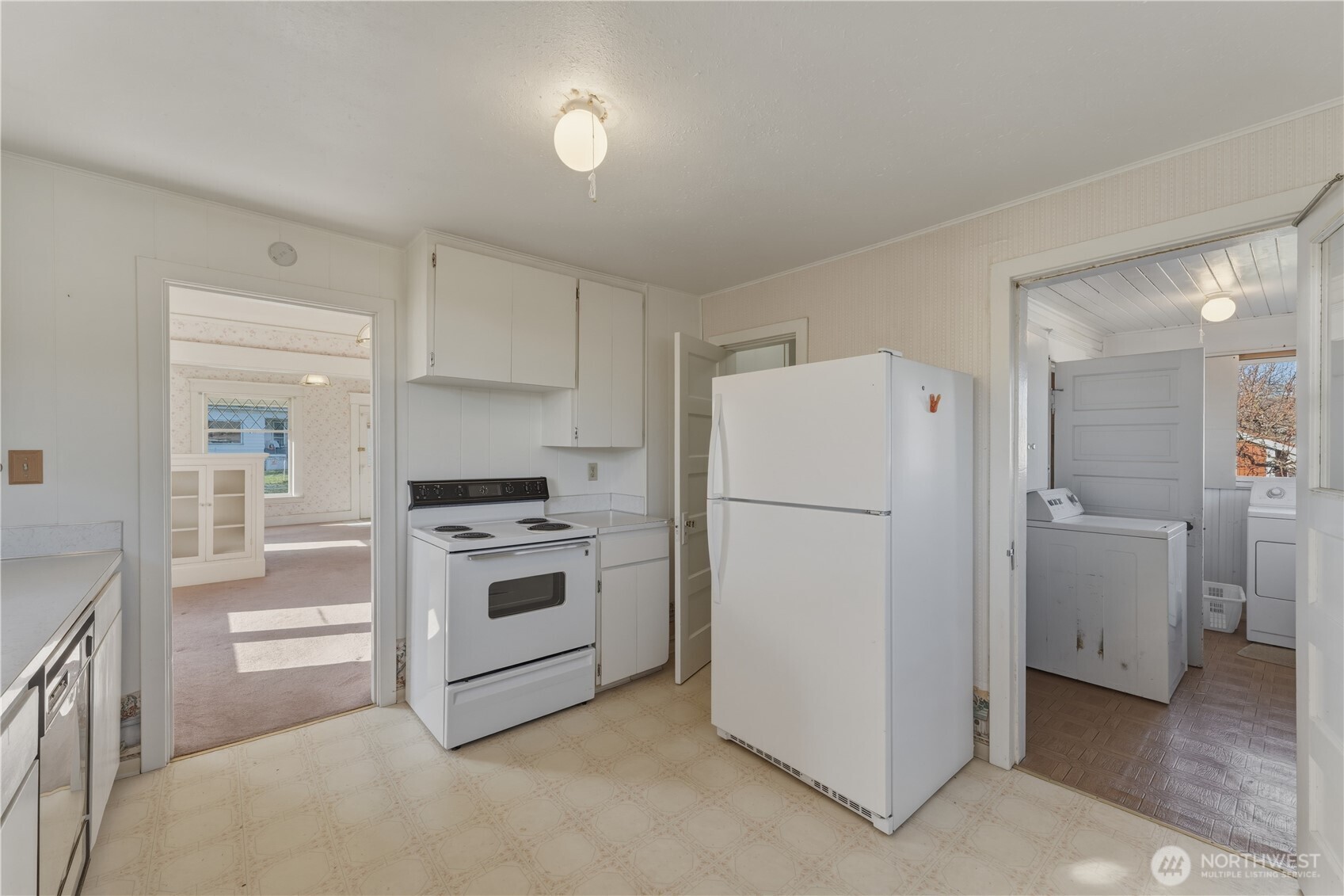 116 Southwest 9th Street College Place, WA 99324 - Photo 14 of 23 a kitchen with a white stove and refrigerator