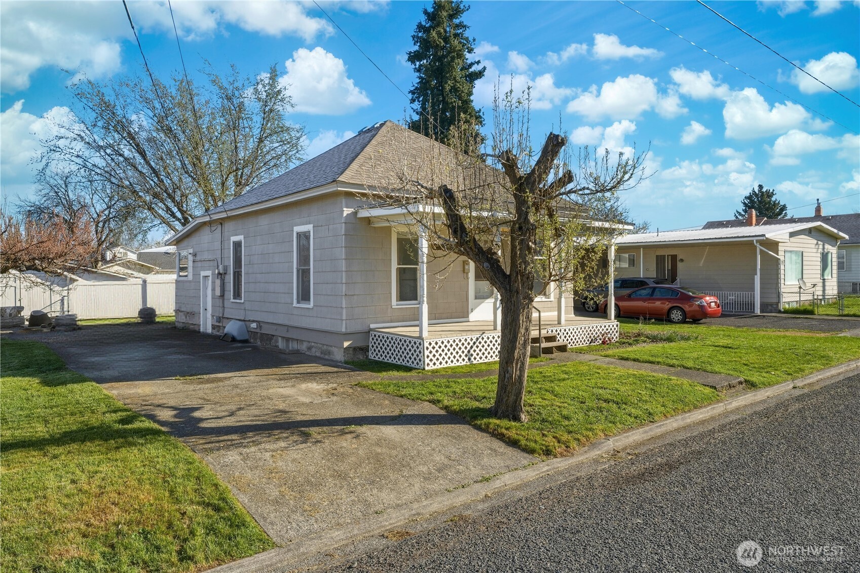 116 Southwest 9th Street College Place, WA 99324 - Photo 2 of 23 a view of a yard in front of a house with large tree